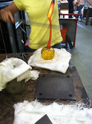 The shaped glass for the stem is dropped onto the pumpkin...